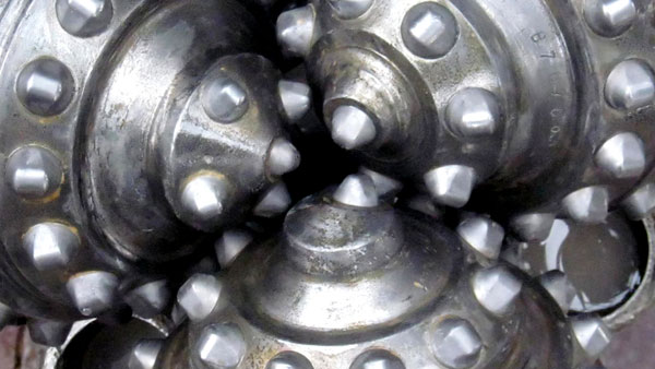 drills shown closely together metal industrial photo closeup for oil and gas company eagle oil and gas in dallas texas